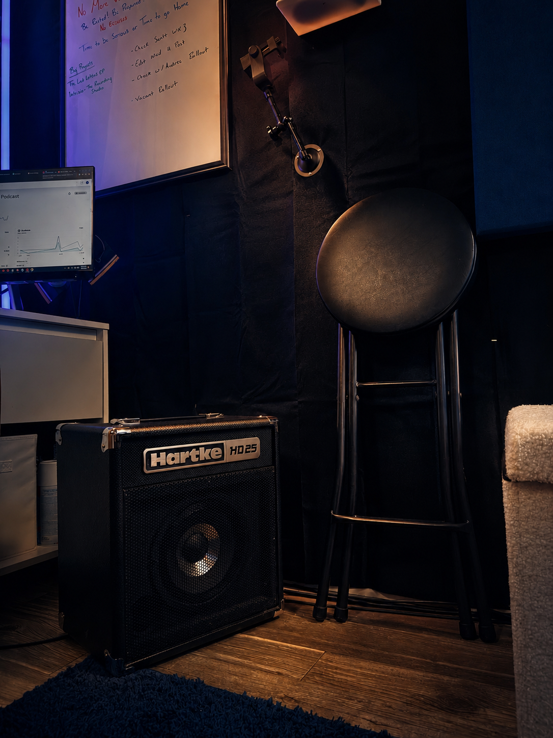 Bass amp and stool in the live corner