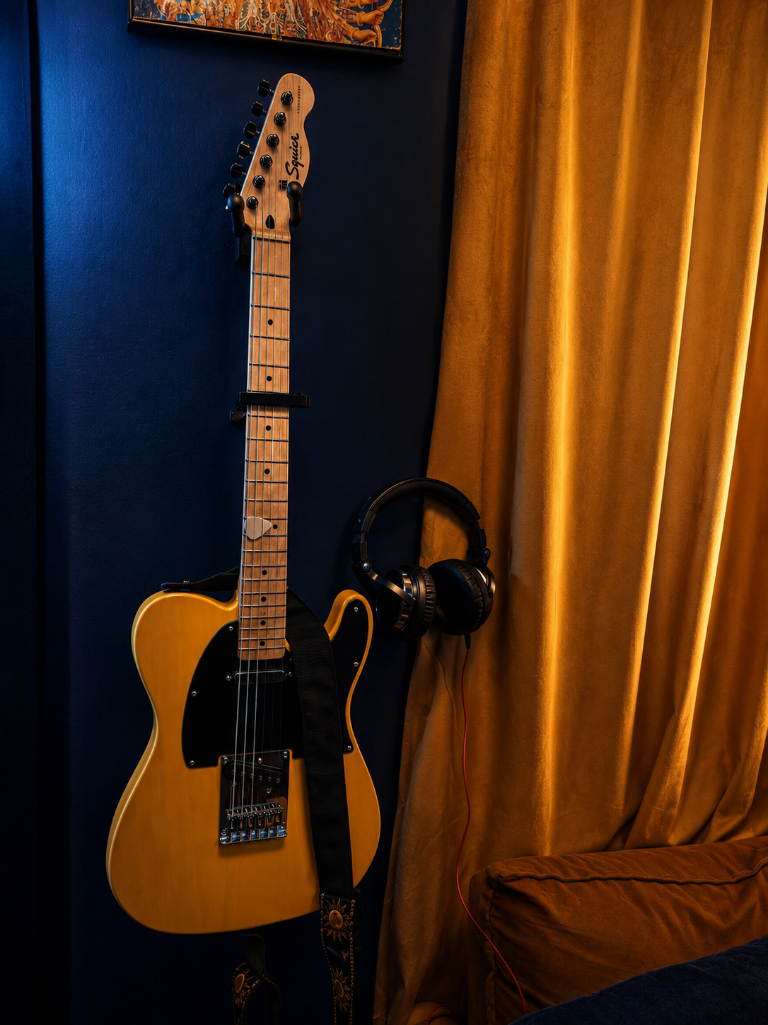 Telecaster and headphones in the studio